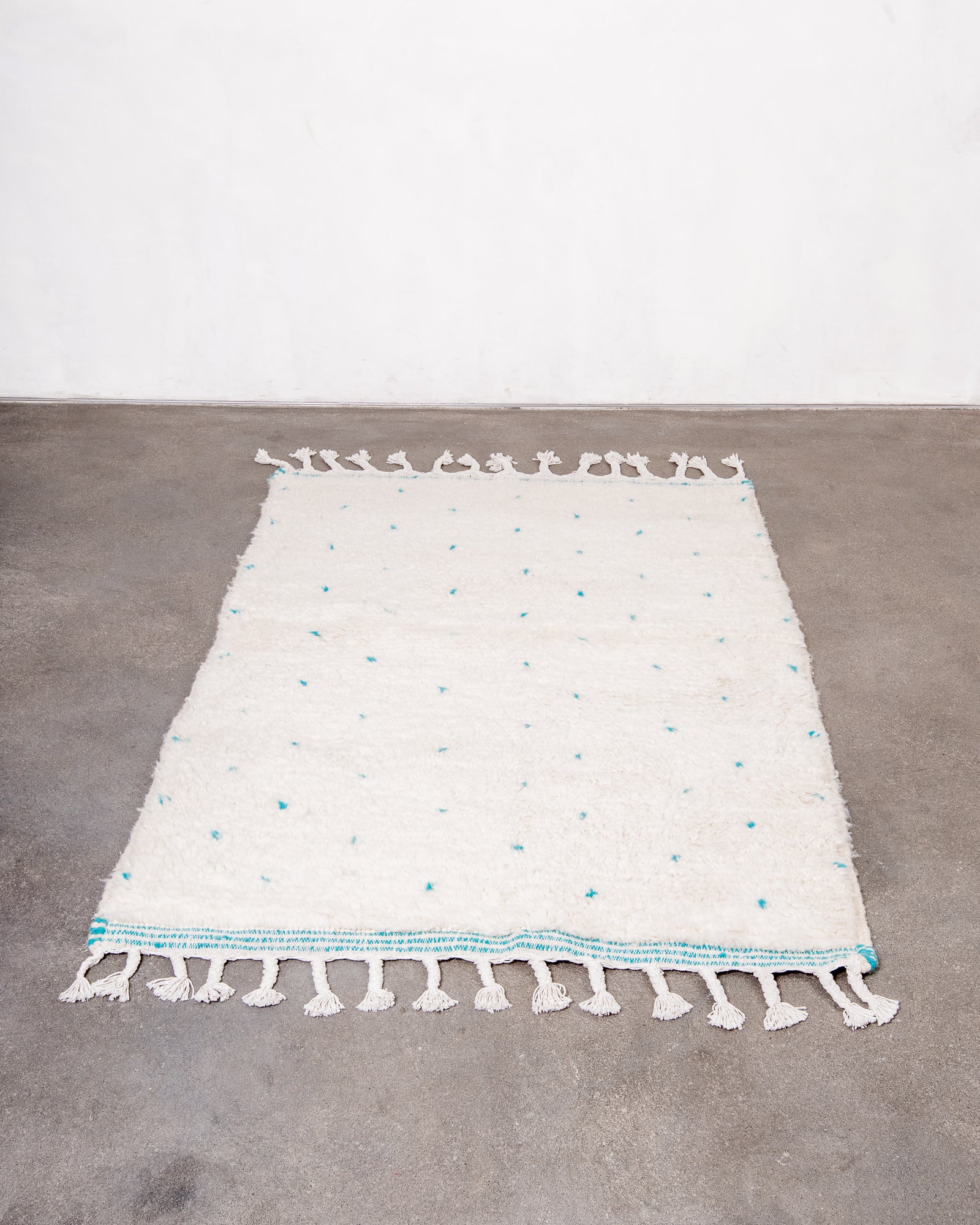 Modern, designer, handcrafted Berber rug from Morocco. Beniourain carpet with beautiful colours and patterns and fluffy wool texture.
